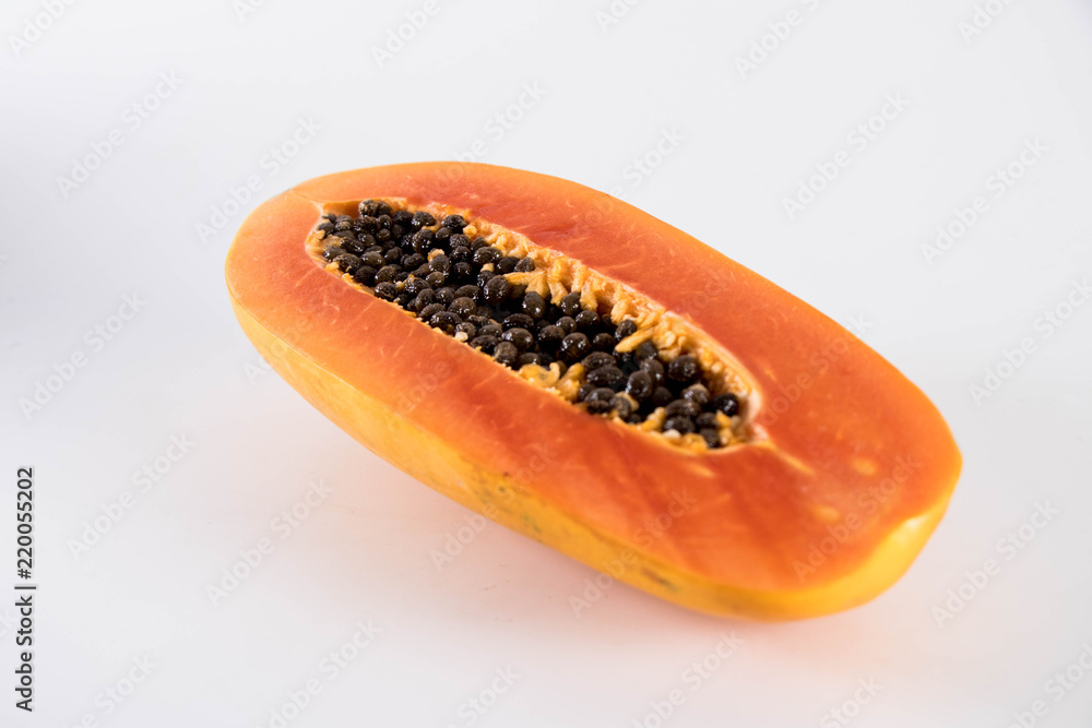 Papaya cooked in half. Papaya cooked in half.