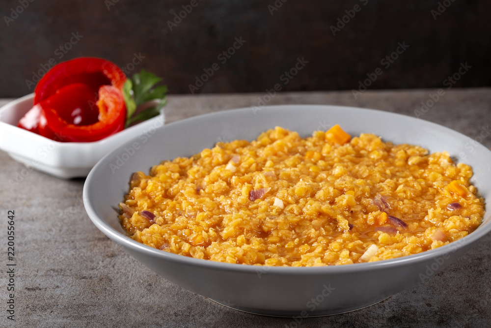 Lentils stew with onion and garlic and some pickles