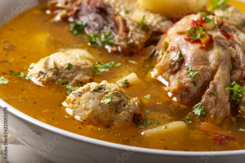 "Ciorba de Perisoare" - Romanian traditional soup with meatballs and chicken meat