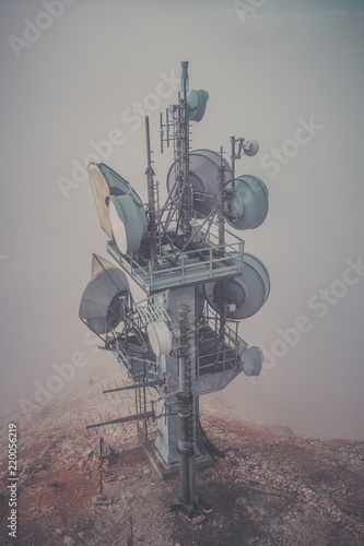 Communication tower with many antenna the mountains, looks like extraterrestrial environment