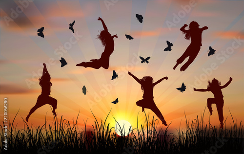girls flying between butterflies at sunset