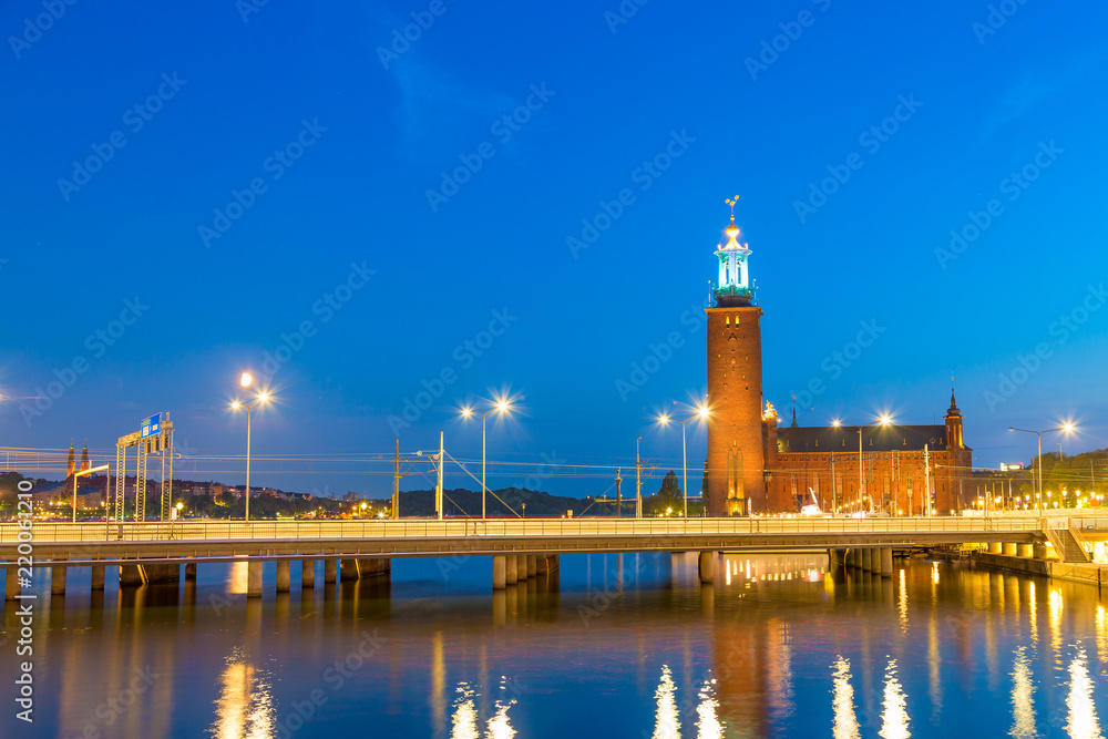 Scenic evening twilight view of the City Hall in the Old Town Gamla Stan in Stockholm, Sweden in summer. Scenic evening twilight view of the City Hall in the Old Town Gamla Stan in Stockholm, Sweden in summer.