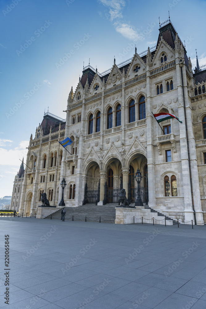 view of the famous building of the Hungarian parliament in Budapest on the blue sky background