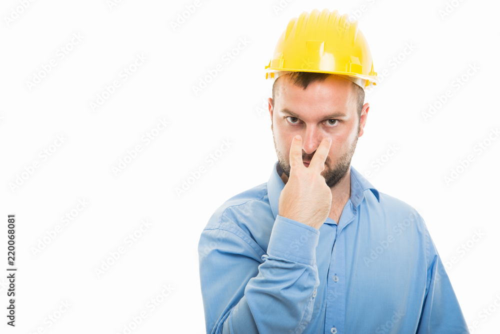 Architect with yellow helmet showing look into my eyes gesture Architect with yellow helmet showing look into my eyes gesture