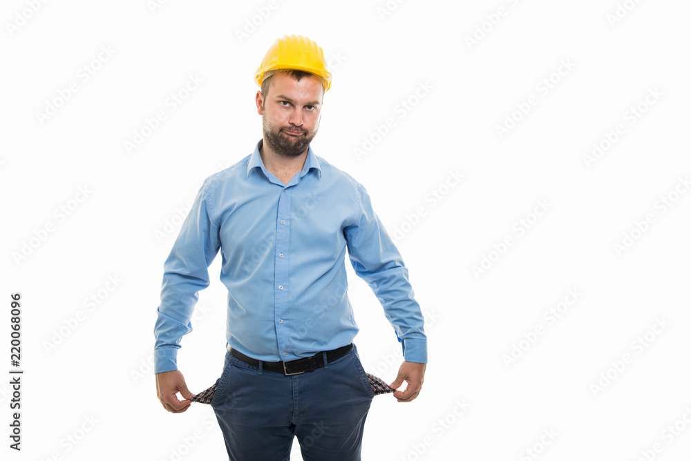 Young architect with yellow helmet showing empty pockets gesture Young architect with yellow helmet showing empty pockets gesture