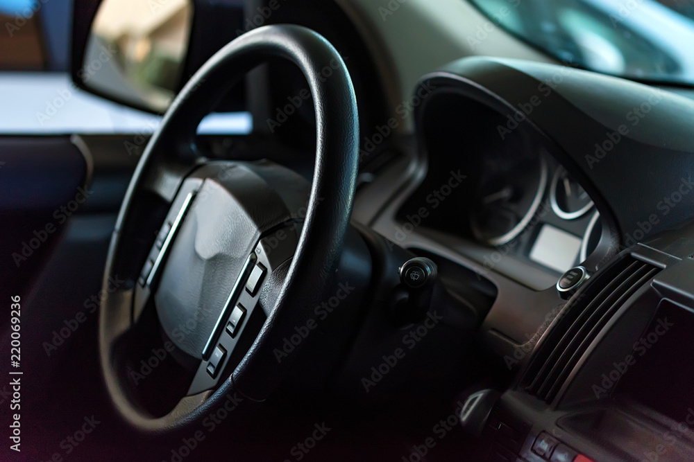 Close-up modern car dashboard and steering wheel