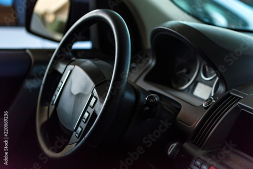 Close-up modern car dashboard and steering wheel © Yakov