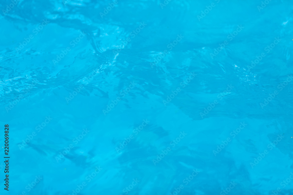 Surface of blue swimming pool. texture of water background in swimming pool