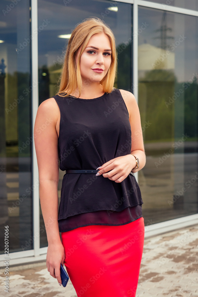 Confident female professional businesswoman in formalwear posing on the street business center office skyscraper background fashion model Confident female professional businesswoman in formalwear posing on the street business center office skyscraper background fashion model