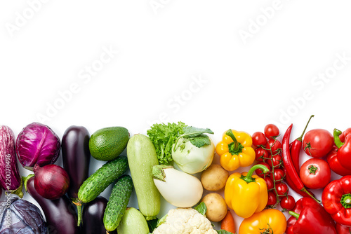 line made of different vegetables and berries isolated on white background. Copy space. Healthy eating background. Food photography. Top view