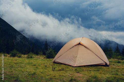 Tent in the mountains before storm