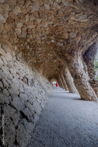 Twisted arch in Park with red woman