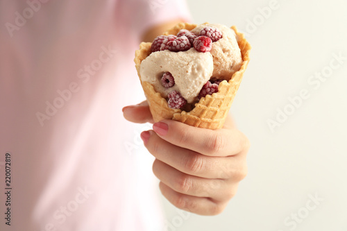 Woman holding waffle cone w...