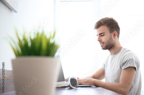 Handsome young man working ...