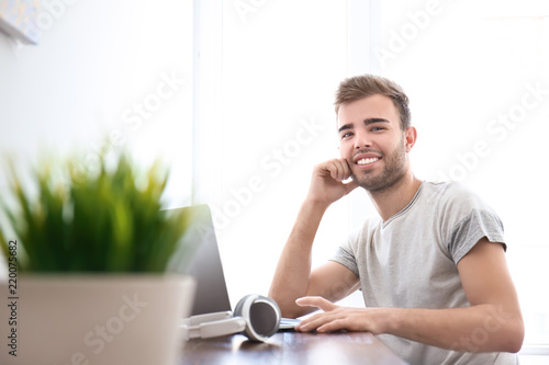 Handsome young man working ...
