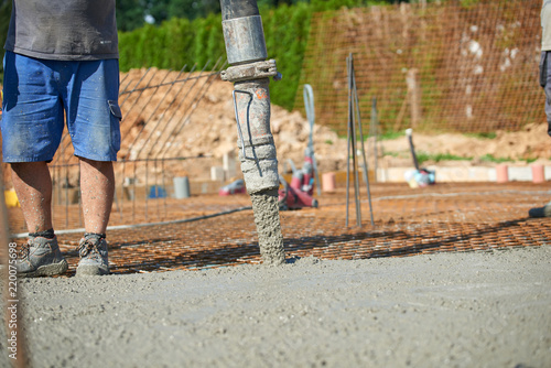 Concrete pouring during commercial concreting floors of building