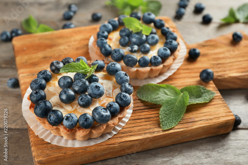Delicious blueberry tarts on board