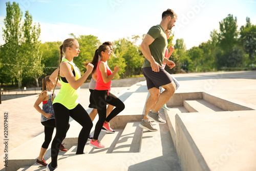 Group of sporty people trai...