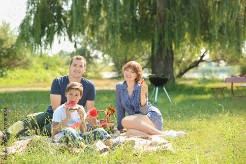 Happy family eating waterme...