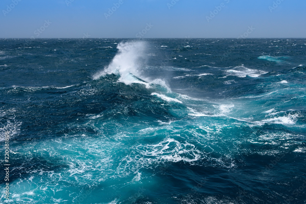 Fototapeta premium Big waves at open sea. Summer monsoon in Indian Ocean