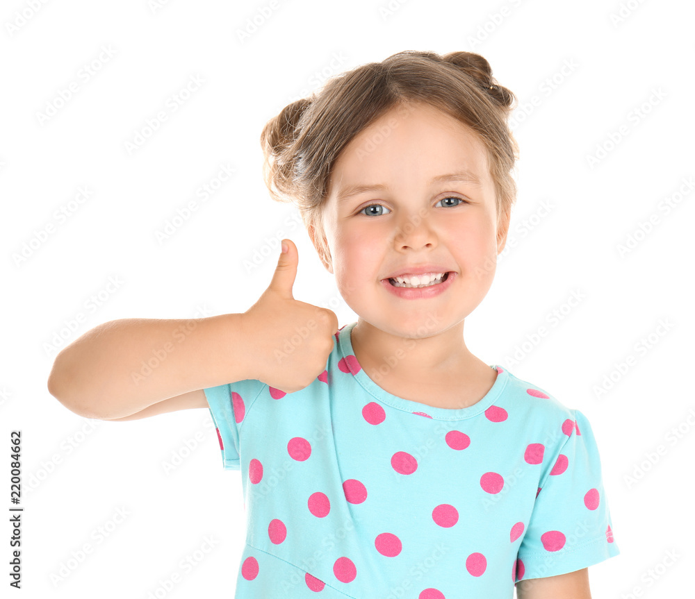 Cute little girl showing thumb-up gesture on white background Cute little girl showing thumb-up gesture on white background