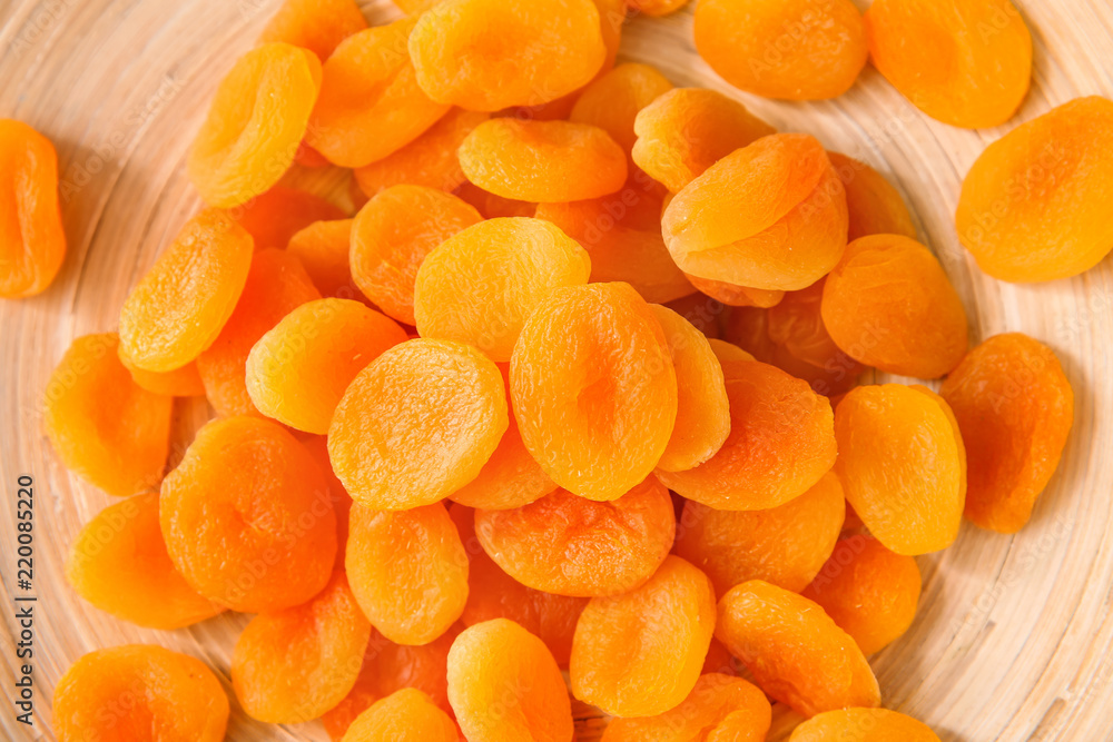 Dried apricots on plate, closeup Dried apricots on plate, closeup
