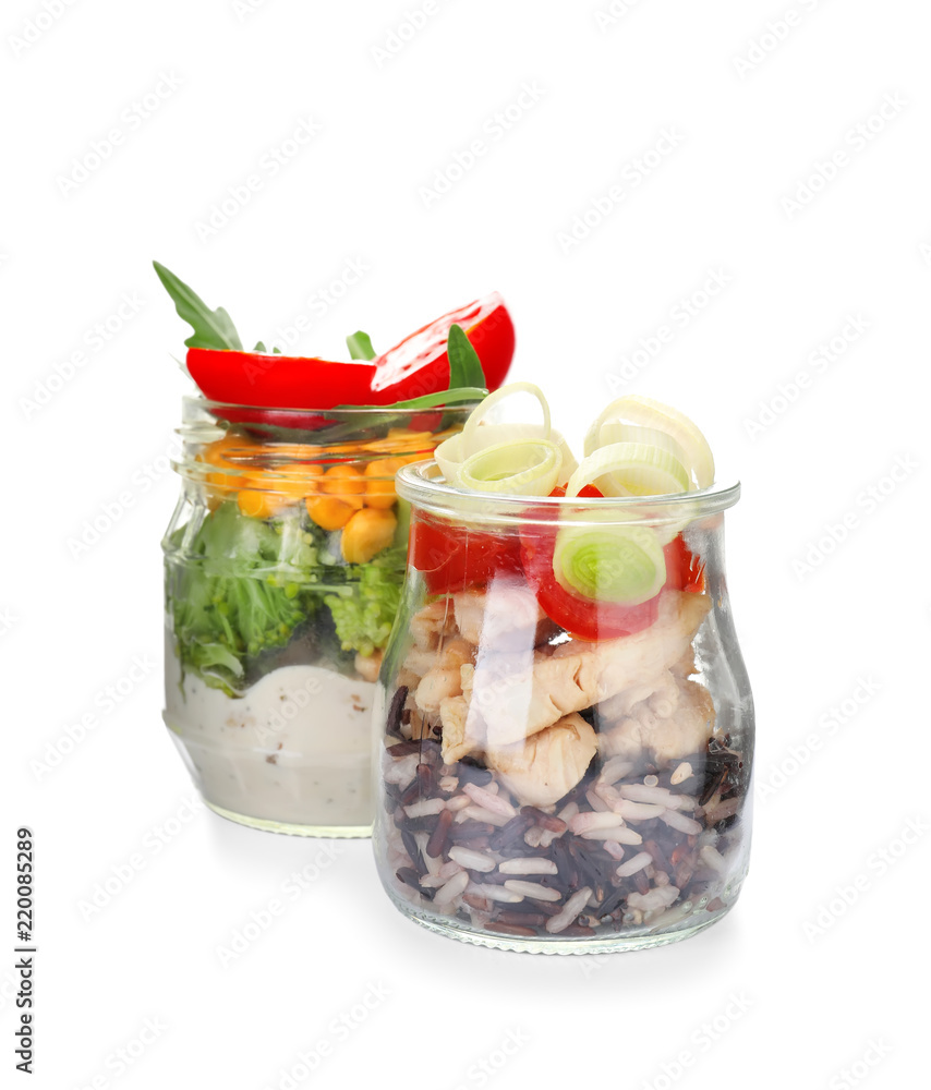 Delicious vegetable salads with chicken in mason jars on white background Delicious vegetable salads with chicken in mason jars on white background