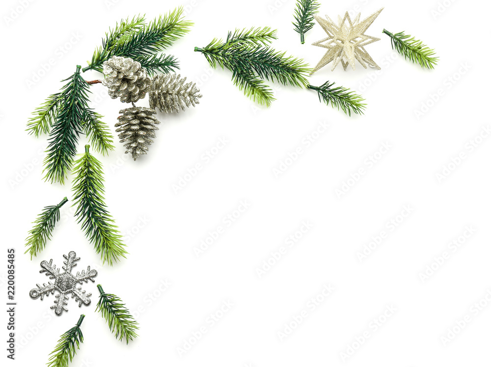 Christmas composition with fir branches and festive decorations on white background