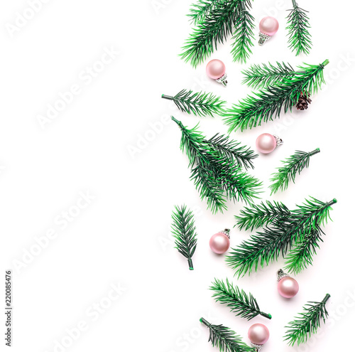 Christmas composition with fir branches and balls on white background