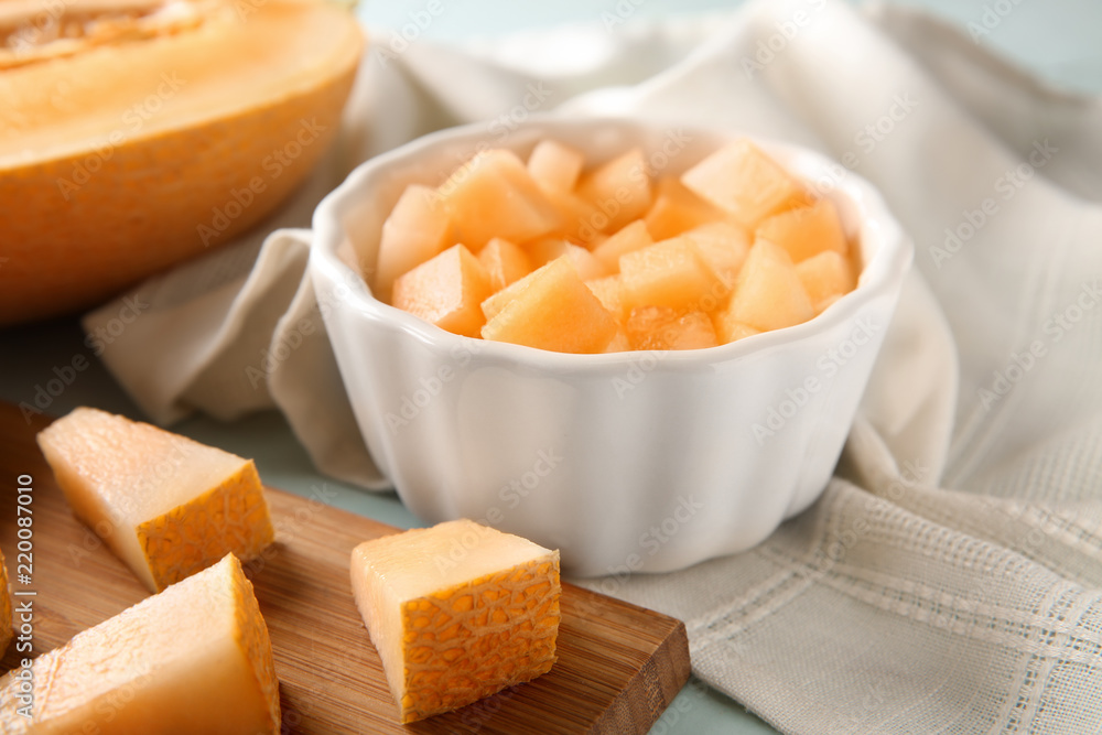 Bowl with pieces of ripe melon on table Bowl with pieces of ripe melon on table
