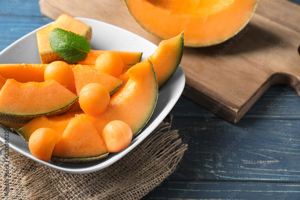 Bowl with cut ripe melon on table Bowl with cut ripe melon on table