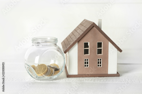 House model and glass jar w...