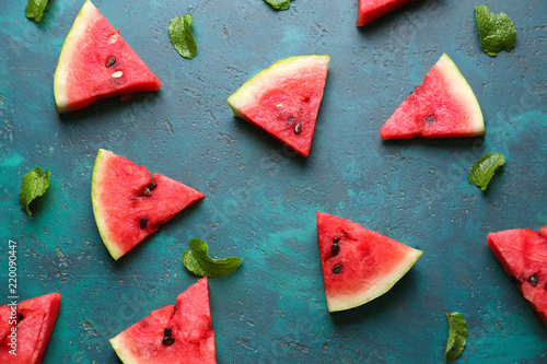 Composition with slices of ripe watermelon on color background