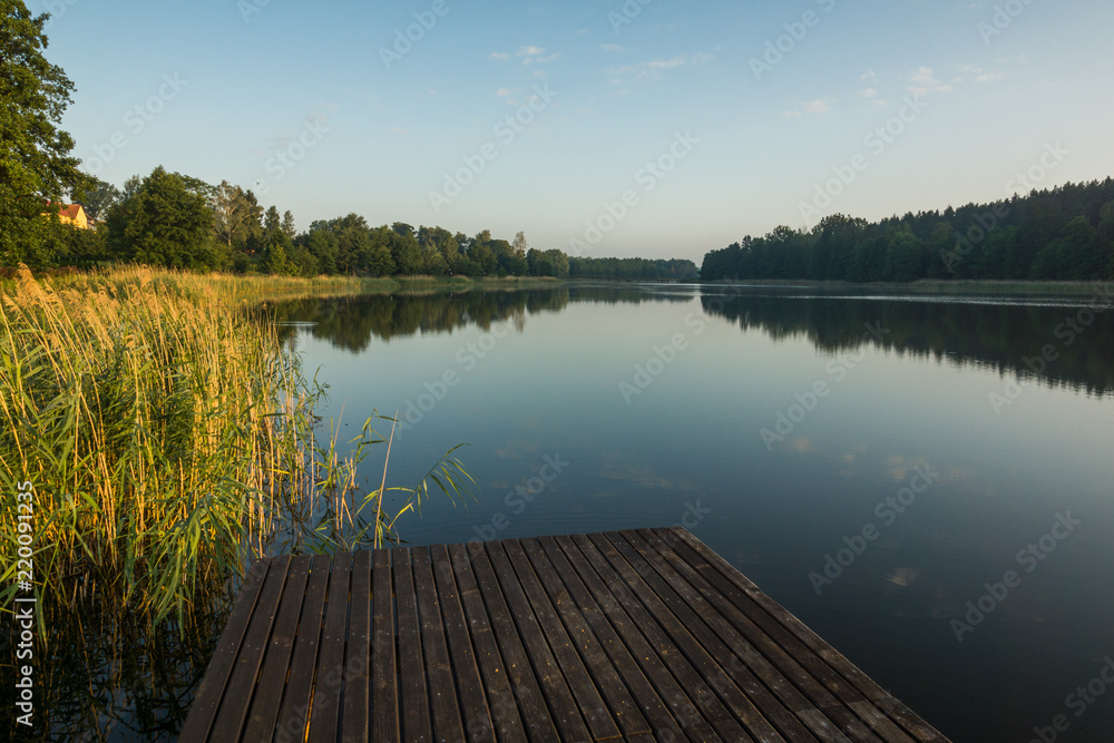 Footbridge on the Wydminskie lake in Wydminy, Masuria, Poland