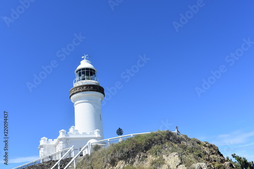 Simple white lighthouse blue skies