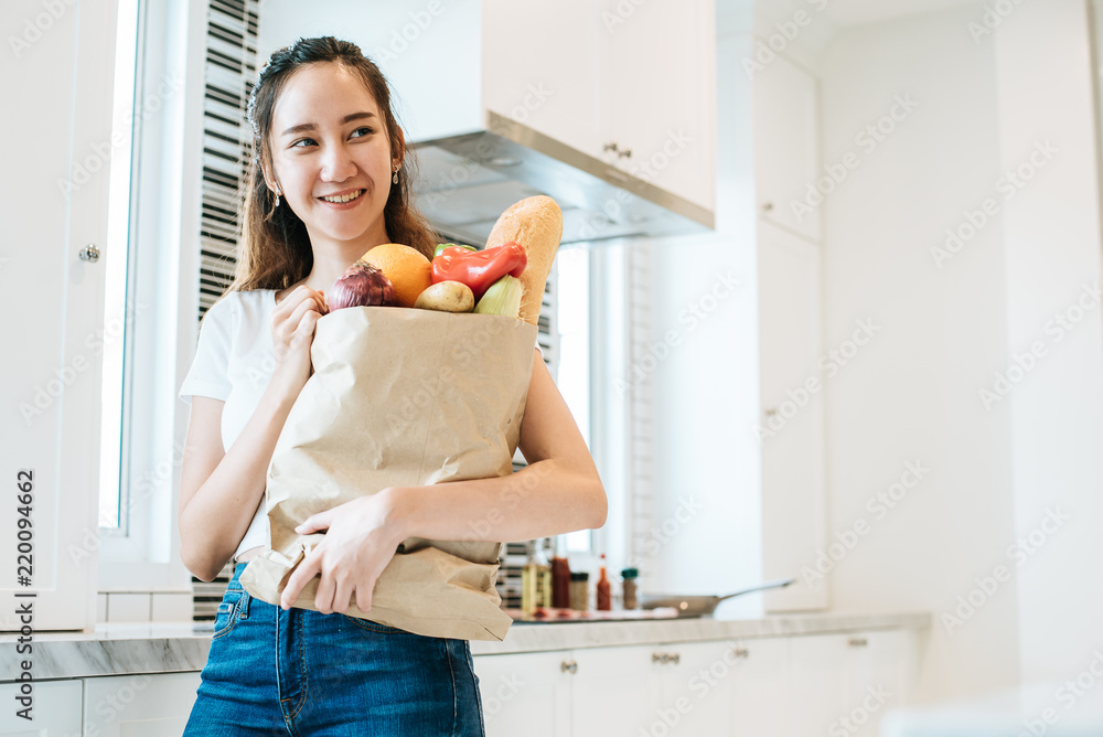 Asian beauty woman holding plenty of ingredients for cooking after shopping at supermarket People and lifestyles concept. Food and meal. Happiness of single woman theme. Dinner party theme. Asian beauty woman holding plenty of ingredients for cooking after shopping at supermarket People and lifestyles concept. Food and meal. Happiness of single woman theme. Dinner party theme.