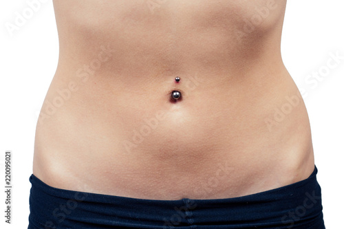 female navel piercing close-up on white background