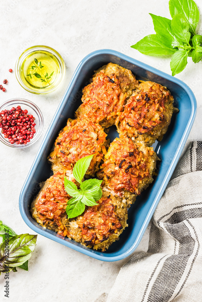 Oven baked chicken and vegetable rissoles in baking dish. Top view, space  for text. Stock Photo | Adobe Stock
