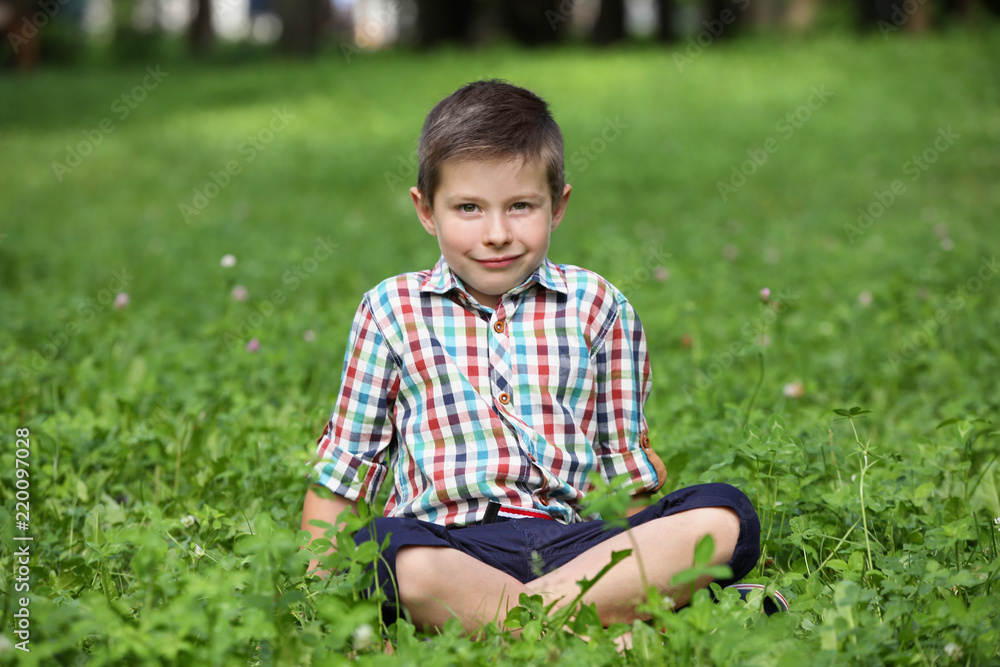 Cute little boy in park on summer day Cute little boy in park on summer day