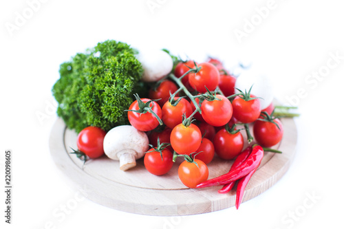 Cherry tomatoes and parsley greens with hot peppers and mushrooms.