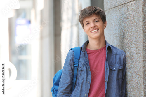 Teenage boy with backpack o...