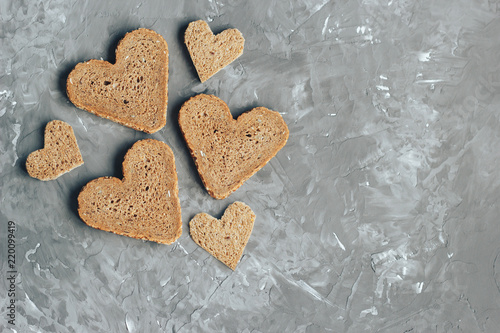 Wallpaper Mural Rye bread in the shape of heart cut into slices on a gray background Torontodigital.ca