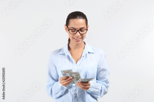 Happy young woman with doll...