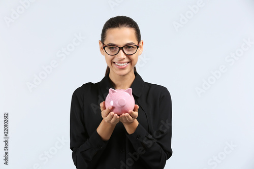 Happy young woman with pigg...