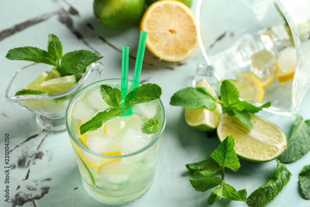 Glass of fresh mojito on light table Glass of fresh mojito on light table