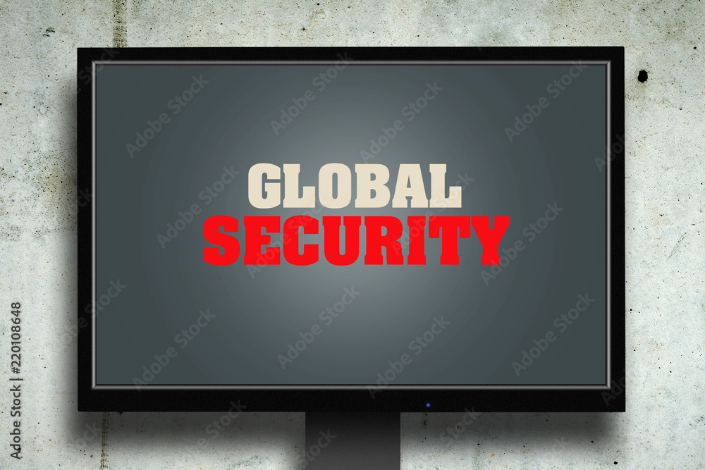 Global security. The inscription on the monitor. Gray concrete background. The concept of security. Computers.
