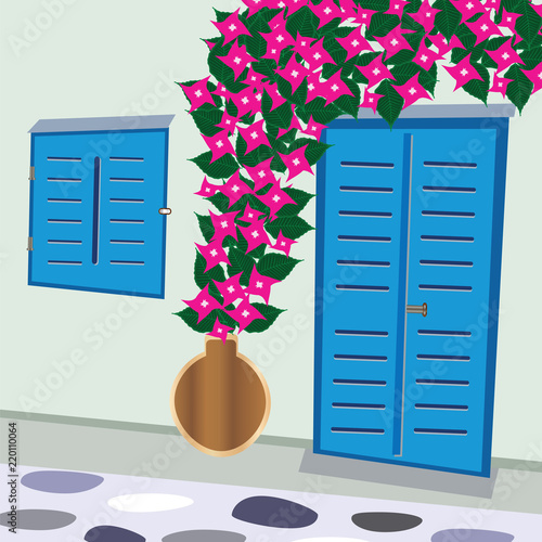 traditional greek door and window with bougainvillea flowers Cyclades Greece