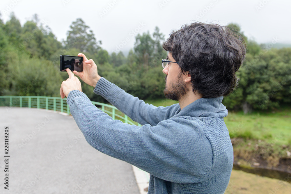 a man with a beard makes a selfie a man with a beard makes a selfie
