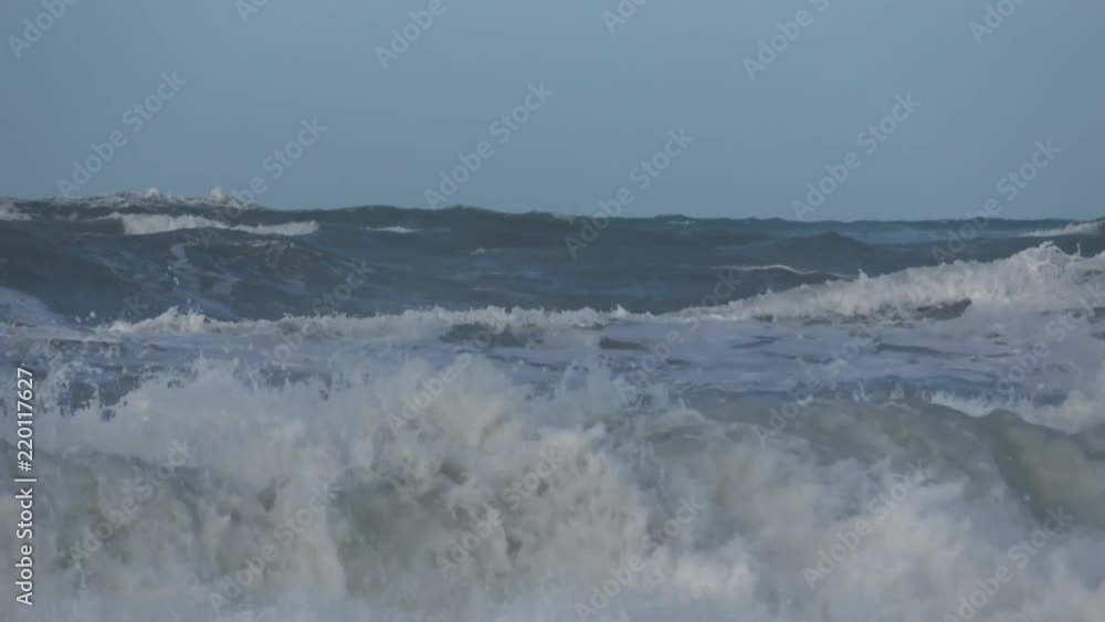 Waves rolling on the beach is a stormy day, winter mediterranean sea. Focene, Lazio, Italy. 4k Waves rolling on the beach is a stormy day, winter mediterranean sea. Focene, Lazio, Italy. 4k