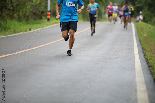 Group of people running race marathon